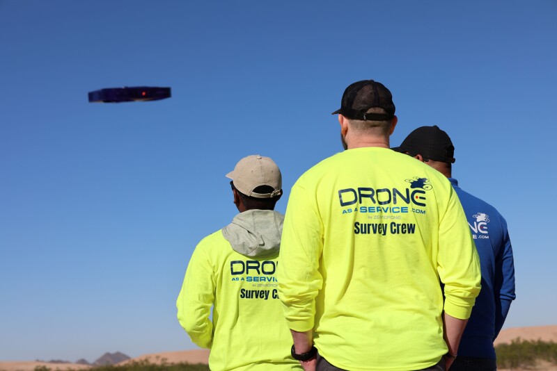 Members of ZenaTech's Drone as a Service team in the field